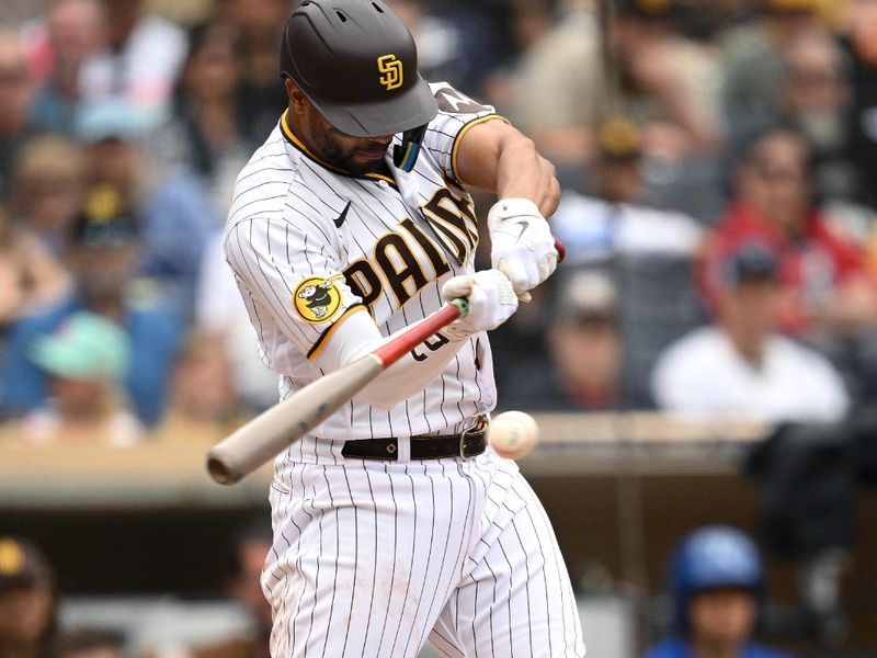 May 17, 2023; San Diego, California, USA; San Diego Padres shortstop Xander Bogaerts (2) hits an RBI single during the sixth inning against the Kansas City Royals at Petco Park. Mandatory Credit: Orlando Ramirez-USA TODAY Sports