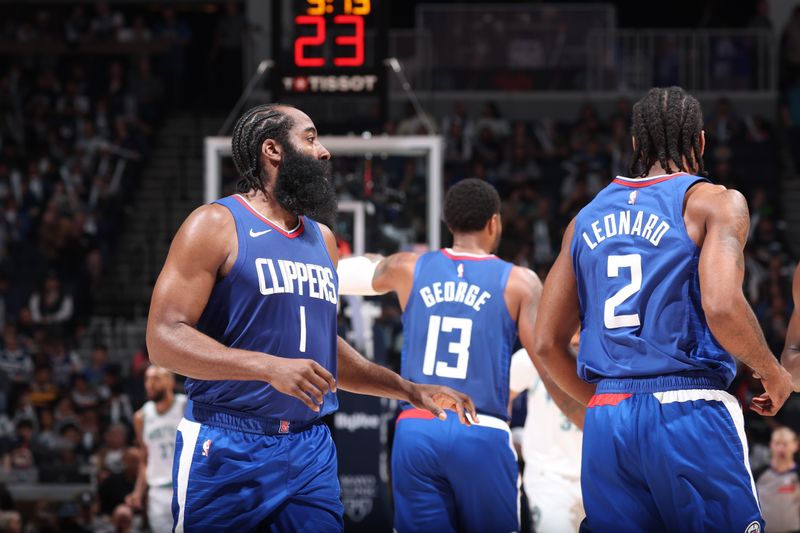 MINNEAPOLIS, MN -  MARCH 3: James Harden #1, Paul George #13 and Kawhi Leonard #2 of the LA Clippers look on during the game against the Minnesota Timberwolves on March 3, 2024 at Target Center in Minneapolis, Minnesota. NOTE TO USER: User expressly acknowledges and agrees that, by downloading and or using this Photograph, user is consenting to the terms and conditions of the Getty Images License Agreement. Mandatory Copyright Notice: Copyright 2024 NBAE (Photo by David Sherman/NBAE via Getty Images)