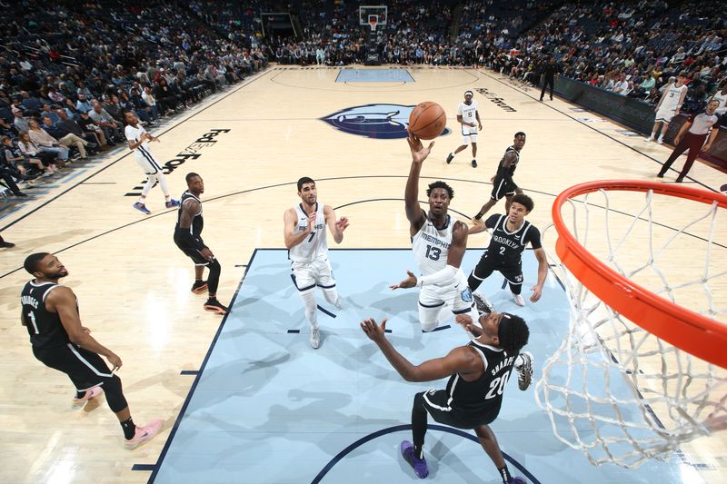 MEMPHIS, TN - February 26:  Jaren Jackson Jr. #13 of the Memphis Grizzlies drives to the basket during the game against the Brooklyn Nets on February 26, 2024 at FedExForum in Memphis, Tennessee. NOTE TO USER: User expressly acknowledges and agrees that, by downloading and or using this photograph, User is consenting to the terms and conditions of the Getty Images License Agreement. Mandatory Copyright Notice: Copyright 2024 NBAE (Photo by Joe Murphy/NBAE via Getty Images)