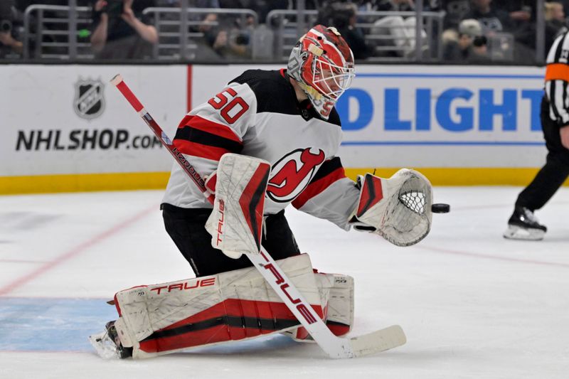 Mar 3, 2024; Los Angeles, California, USA; New Jersey Devils goaltender Nico Daws (50) makes a save in the second period against the Los Angeles Kings at Crypto.com Arena. Mandatory Credit: Jayne Kamin-Oncea-USA TODAY Sports