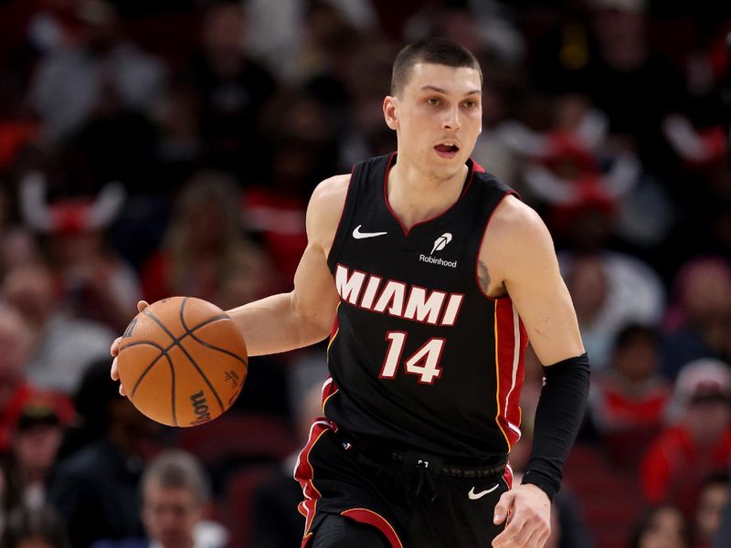 CHICAGO, ILLINOIS - FEBRUARY 04: Tyler Herro #14 of the Miami Heat in action against the Chicago Bulls at the United Center on February 04, 2025 in Chicago, Illinois. NOTE TO USER: User expressly acknowledges and agrees that, by downloading and or using this photograph, user is consenting to the terms and conditions of the Getty Images License Agreement.  (Photo by Luke Hales/Getty Images)