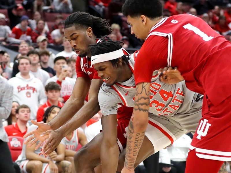 Feb 6, 2024; Columbus, Ohio, USA; Ohio State Buckeyes center Felix Okpara (34) goes for the loose ball with Indiana Hoosiers center Kel'el Ware (1) and forward Mackenzie Mgbako (21) during the second half at Value City Arena. Mandatory Credit: Joseph Maiorana-USA TODAY Sports