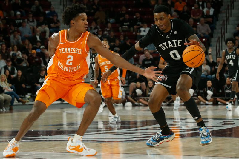 Jan 17, 2023; Starkville, Mississippi, USA; Mississippi State Bulldogs forward D.J. Jeffries (0) dribbles as Tennessee Volunteers forward Julian Phillips (2) defends during the second half at Humphrey Coliseum. Mandatory Credit: Petre Thomas-USA TODAY Sports