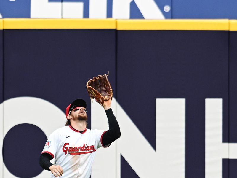May 1, 2025; Cleveland, Ohio, USA; Cleveland Guardians center fielder Daniel Schneemann (10) catches a ball hit by Minnesota Twins right fielder Kody Clemens (not pictured) during the fourth inning at Progressive Field. Mandatory Credit: Ken Blaze-Imagn Images

