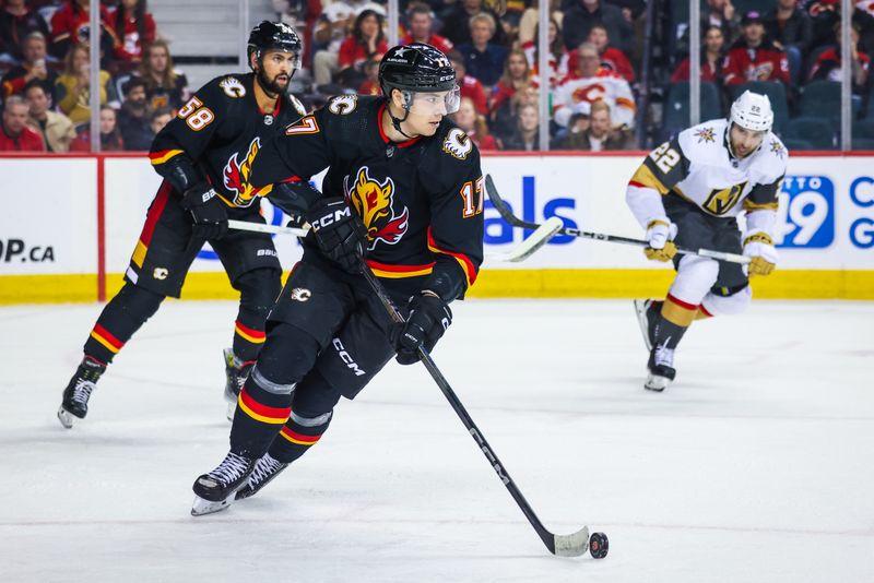 Mar 14, 2024; Calgary, Alberta, CAN; Calgary Flames center Yegor Sharangovich (17) controls the puck against the Vegas Golden Knights during the third period at Scotiabank Saddledome. Mandatory Credit: Sergei Belski-USA TODAY Sports