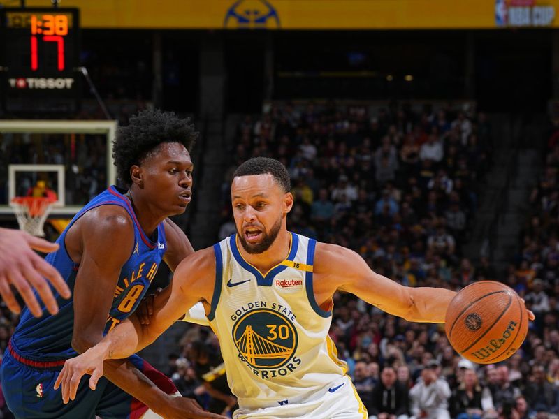 DENVER, CO - DECEMBER 3: Stephen Curry #30 of the Golden State Warriors drives to the basket during the game against the Denver Nuggets during the Emirates NBA Cup on December 3, 2024 at Ball Arena in Denver, Colorado. NOTE TO USER: User expressly acknowledges and agrees that, by downloading and/or using this Photograph, user is consenting to the terms and conditions of the Getty Images License Agreement. Mandatory Copyright Notice: Copyright 2024 NBAE (Photo by Garrett Ellwood/NBAE via Getty Images)