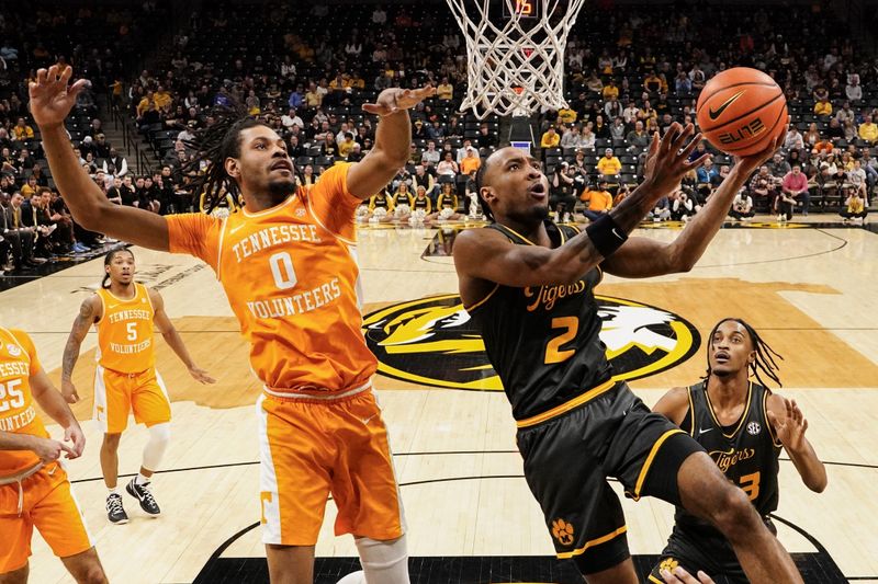 Feb 20, 2024; Columbia, Missouri, USA; Missouri Tigers guard Tamar Bates (2) shoots as Tennessee Volunteers forward Jonas Aidoo (0) defends during the first half at Mizzou Arena. Mandatory Credit: Denny Medley-USA TODAY Sports