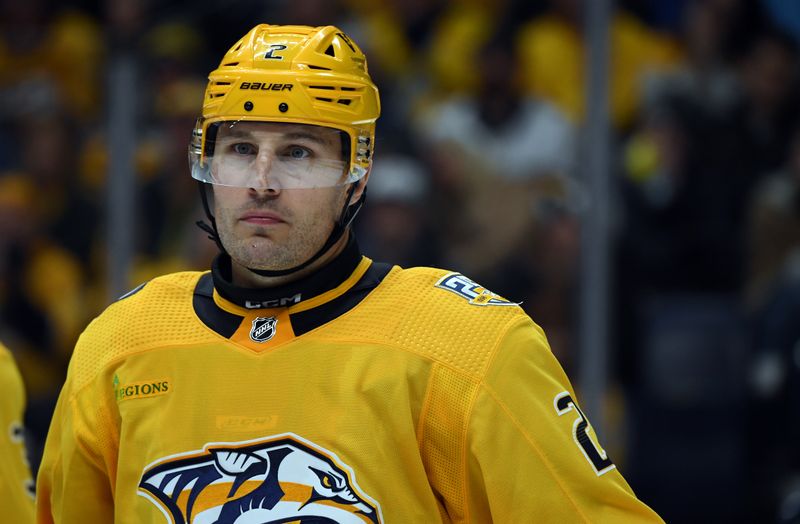 Nov 26, 2023; Nashville, Tennessee, USA; Nashville Predators defenseman Luke Schenn (2) waits for a face off during the second period against the Winnipeg Jets at Bridgestone Arena. Mandatory Credit: Christopher Hanewinckel-USA TODAY Sports