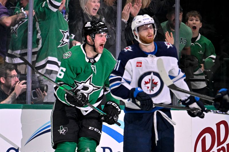 May 11, 2025; Dallas, Texas, USA; Dallas Stars right wing Mikko Rantanen (96) celebrates scoring a goal as Winnipeg Jets left wing Kyle Connor (81) looks on during the third period in game three of the second round of the 2025 Stanley Cup Playoffs at American Airlines Center. Mandatory Credit: Jerome Miron-Imagn Images