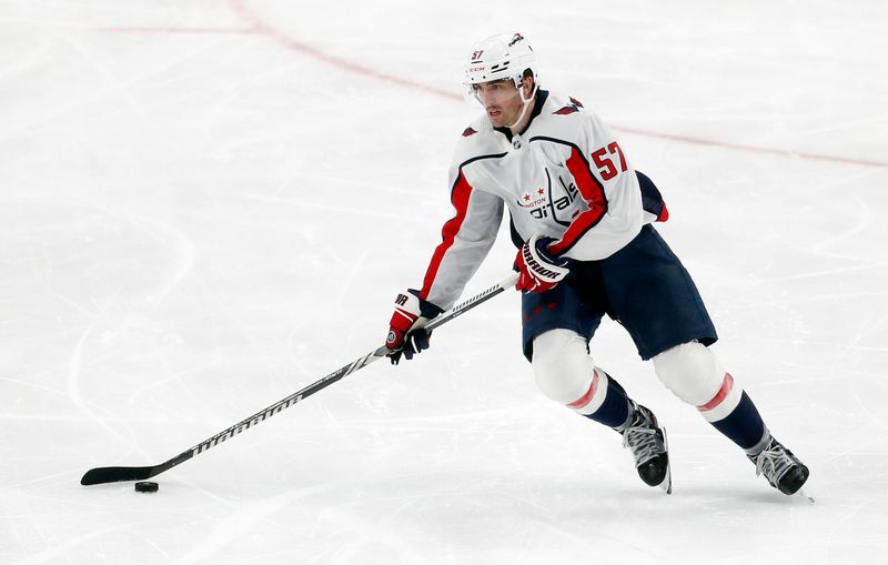 Mar 7, 2024; Pittsburgh, Pennsylvania, USA; Washington Capitals defenseman Trevor van Riemsdyk (57) moves the puck against the Pittsburgh Penguins during the third period at PPG Paints Arena. The Capitals shutout the Penguins 6-0. Mandatory Credit: Charles LeClaire-USA TODAY Sports