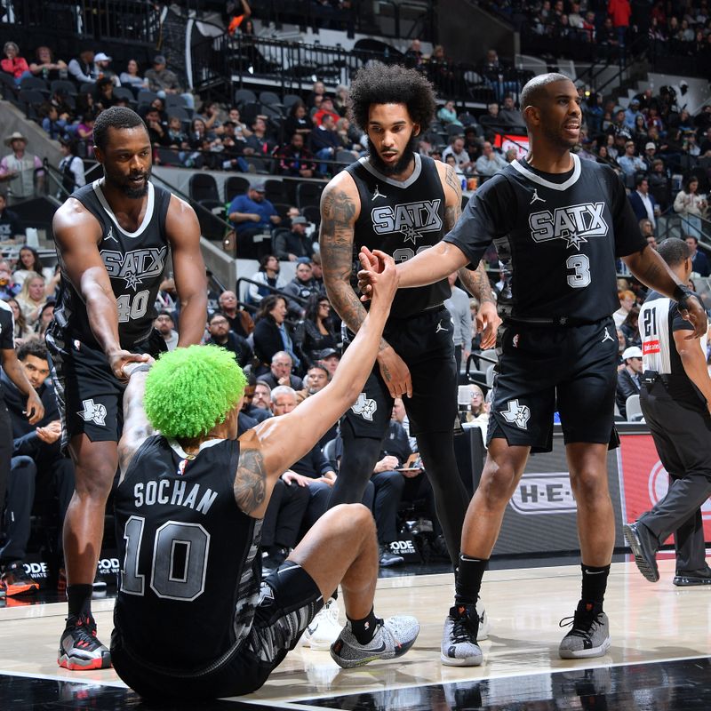 SAN ANTONIO, TX - DECEMBER 5: Jeremy Sochan #10 is helped up by Harrison Barnes #40 and Chris Paul #3 of the San Antonio Spurs during the game against the Chicago Bulls on December 5, 2024 at the Frost Bank Center in San Antonio, Texas. NOTE TO USER: User expressly acknowledges and agrees that, by downloading and or using this photograph, user is consenting to the terms and conditions of the Getty Images License Agreement. Mandatory Copyright Notice: Copyright 2024 NBAE (Photos by Michael Gonzales/NBAE via Getty Images)