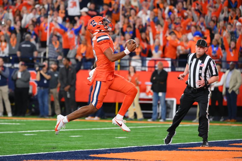 Nov 3, 2023; Syracuse, New York, USA; Syracuse Orange quarterback Carlos Del Rio-Wilson (16) scores a touchdown against the Boston College Eagles during the first half at the JMA Wireless Dome. Mandatory Credit: Rich Barnes-USA TODAY Sports