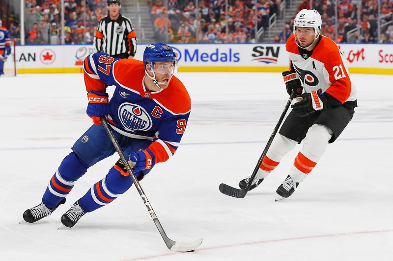 Oct 15, 2024; Edmonton, Alberta, CAN; Edmonton Oilers forward Connor McDavid (97) carries the puck around Philadelphia Flyers forward Scott Laughton (21) during the first period at Rogers Place. Mandatory Credit: Perry Nelson-Imagn Images