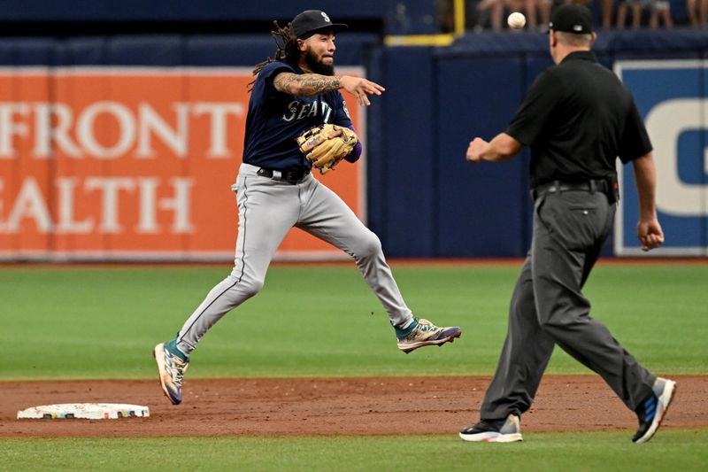 Sep 10, 2023; St. Petersburg, Florida, USA; Seattle Mariners shortstop J.P. Crawford (3) turns a double play in the first inning against the Tampa Bay Rays at Tropicana Field. Mandatory Credit: Jonathan Dyer-USA TODAY Sports