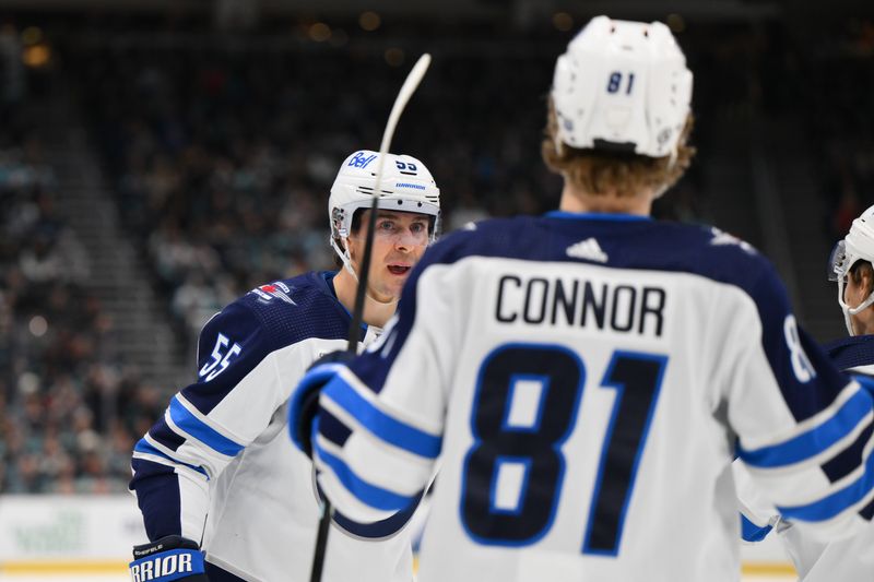 Mar 8, 2024; Seattle, Washington, USA; Winnipeg Jets center Mark Scheifele (55) celebrates after scoring a goal against the Seattle Kraken during the third period at Climate Pledge Arena. Mandatory Credit: Steven Bisig-USA TODAY Sports