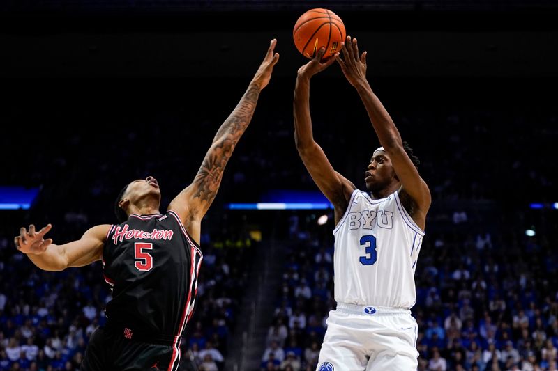 Feb 7, 2026; Provo, Utah, USA; BYU Cougars forward AJ Dybantsa (3) shoots the ball while being defended by Houston Cougars forward Chris Cenac Jr. (5) during the first half at Marriott Center. Mandatory Credit: Aaron Baker-Imagn Images