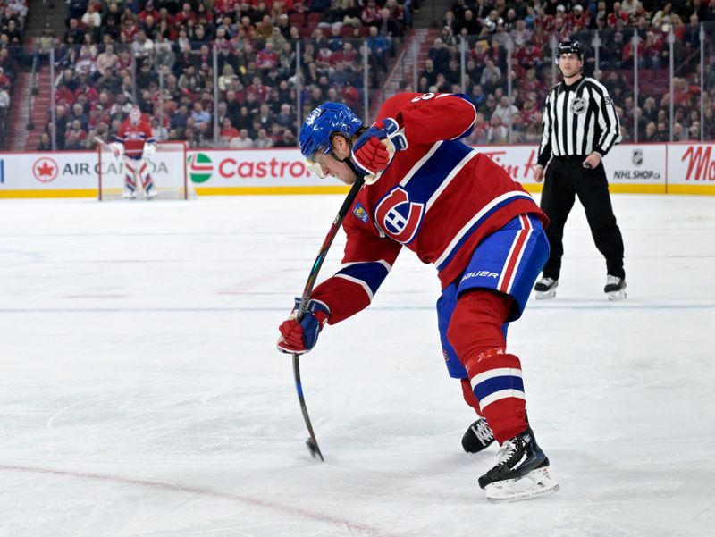 Apr 8, 2025; Montreal, Quebec, CAN; Montreal Canadiens forward Patrik Laine (92) takes a shot on net during the second period of the game against the Detroit Red Wings  at the Bell Centre. Mandatory Credit: Eric Bolte-Imagn Images