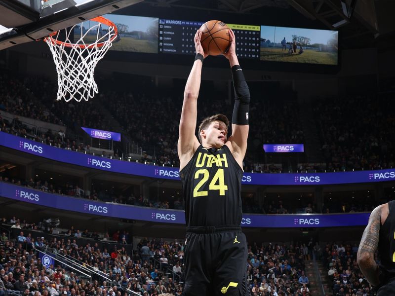 SALT LAKE CITY, UT - FEBRUARY 12: Walker Kessler #24 of the Utah Jazz rebounds the ball during the game  against the Golden State Warriors on February 12, 2024 at Delta Center in Salt Lake City, Utah. NOTE TO USER: User expressly acknowledges and agrees that, by downloading and or using this Photograph, User is consenting to the terms and conditions of the Getty Images License Agreement. Mandatory Copyright Notice: Copyright 2024 NBAE (Photo by Melissa Majchrzak/NBAE via Getty Images)