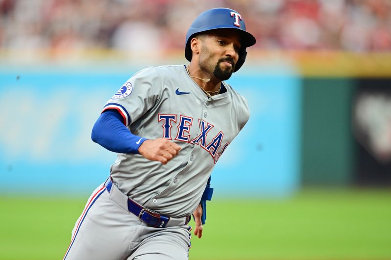 Aug 23, 2024; Cleveland, Ohio, USA; Texas Rangers center fielder Leody Taveras (3) rounds third base en route to scoring  during the second inning against the Cleveland Guardians at Progressive Field. Mandatory Credit: Ken Blaze-USA TODAY Sports