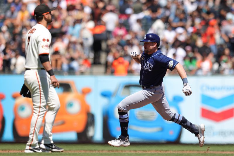 Aug 16, 2023; San Francisco, California, USA; Tampa Bay Rays first baseman Luke Raley (55) hits an inside the park home run during the sixth inning against the San Francisco Giants  at Oracle Park. Mandatory Credit: Sergio Estrada-USA TODAY Sports