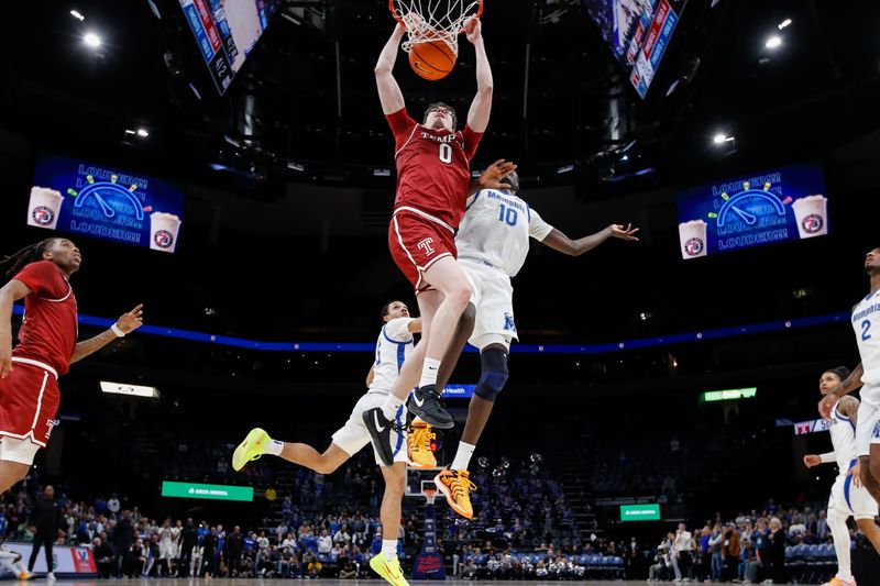Jan 14, 2026; Memphis, Tennessee, USA; Temple Owls guard Gavin Griffiths (0) dunks the ball against Memphis Tigers center Simon Majok (10) during the second half at FedExForum. Mandatory Credit: Wesley Hale-Imagn Images