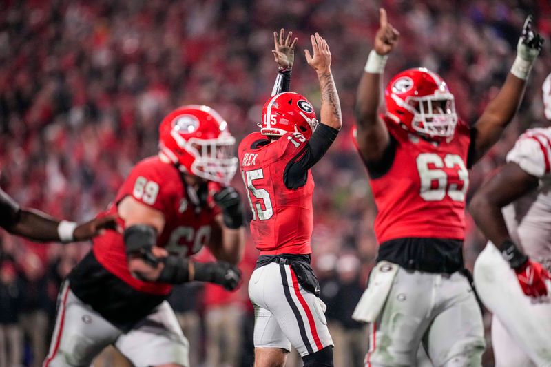 Nov 11, 2023; Athens, Georgia, USA; A Georgia Bulldogs quarterback Carson Beck (15) reacts after throwing a touchdown pass against the Mississippi Rebels during the second half at Sanford Stadium. Mandatory Credit: Dale Zanine-USA TODAY Sports