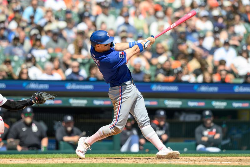 May 11, 2025; Detroit, Michigan, USA; Texas Rangers third baseman Josh Jung (6) hits a two-run home run against the Detroit Tigers in the fifth inning at Comerica Park. Mandatory Credit: Lon Horwedel-Imagn Images