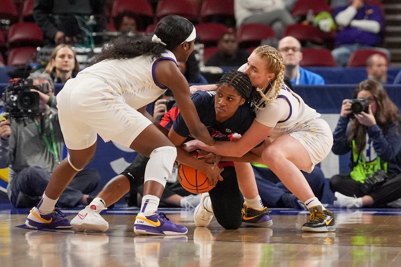 Mar 9, 2024; Greensville, SC, USA; Ole Miss Rebels guard Ayanna Thompson (20) tries to hold onto the ball while pressured by LSU Lady Tigers guard Hailey Van Lith (11) during the second half at Bon Secours Wellness Arena. Mandatory Credit: Jim Dedmon-USA TODAY Sports