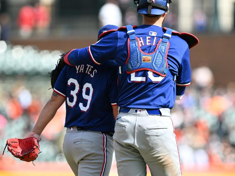 Apr 18, 2024; Detroit, Michigan, USA;  Texas Rangers pitcher Kirby Yates (39) and catcher Jonah Heim (28) celebrate their win over the  Detroit Tigers at Comerica Park. Mandatory Credit: Lon Horwedel-USA TODAY Sports