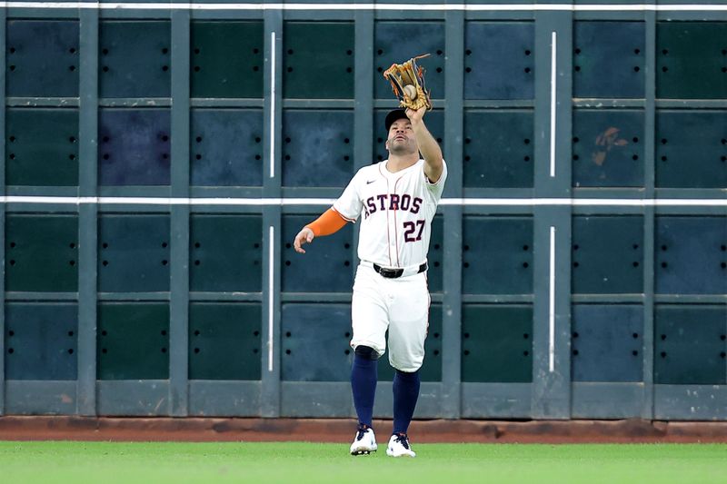 May 28, 2025; Houston, Texas, USA; Houston Astros left fielder Jose Altuve (27) catches a fly ball for an out against the Athletics during the sixth inning at Daikin Park. Mandatory Credit: Erik Williams-Imagn Images