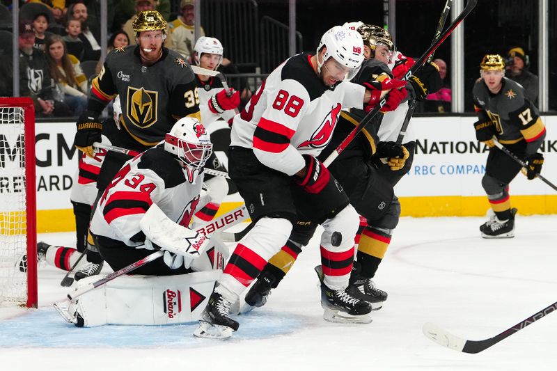 Mar 17, 2024; Las Vegas, Nevada, USA; New Jersey Devils defenseman Kevin Bahl (88) blocks a shot in front of New Jersey Devils goaltender Jake Allen (34) during the third period at T-Mobile Arena. Mandatory Credit: Stephen R. Sylvanie-USA TODAY Sports