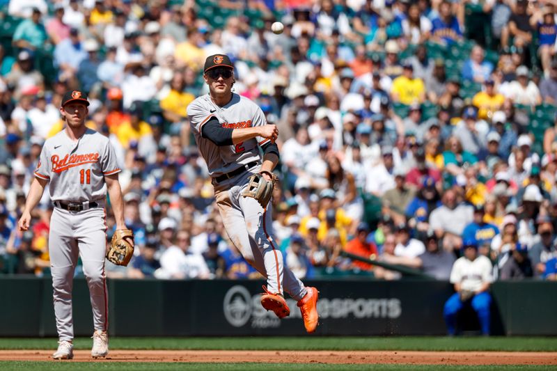 Aug 13, 2023; Seattle, Washington, USA; Baltimore Orioles shortstop Gunnar Henderson (2) throw to first base for an out against the Seattle Mariners during the first inning at T-Mobile Park. Mandatory Credit: Joe Nicholson-USA TODAY Sports