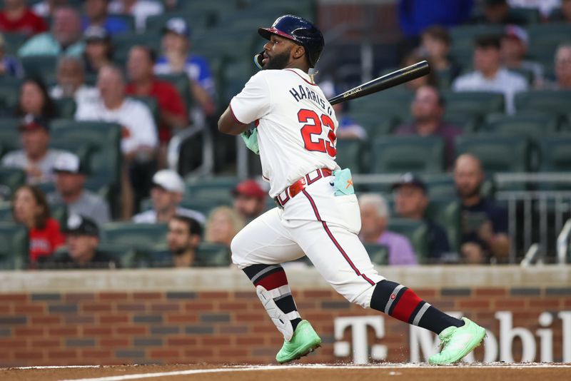 Sep 24, 2024; Atlanta, Georgia, USA; Atlanta Braves center fielder Michael Harris II (23) hits a single against the New York Mets in the first inning at Truist Park. Mandatory Credit: Brett Davis-Imagn Images