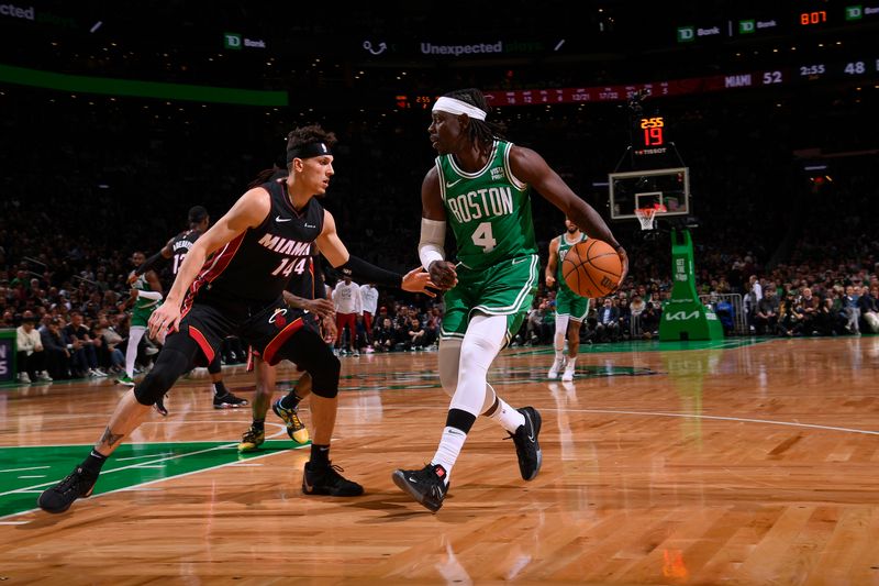 BOSTON, MA - APRIL 24: Tyler Herro #14 of the Miami Heat plays defense during the game  against Jrue Holiday #4 of the Boston Celtics during Round 1 Game 2 of the 2024 NBA Playoffs on April 24, 2024 at the TD Garden in Boston, Massachusetts. NOTE TO USER: User expressly acknowledges and agrees that, by downloading and or using this photograph, User is consenting to the terms and conditions of the Getty Images License Agreement. Mandatory Copyright Notice: Copyright 2024 NBAE  (Photo by Brian Babineau/NBAE via Getty Images)