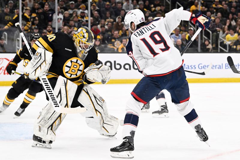 Feb 26, 2026; Boston, Massachusetts, USA; Boston Bruins goaltender Michael DiPietro (80) makes a save against Columbus Blue Jackets center Adam Fantilli (19) during the second period at TD Garden. Mandatory Credit: Eric Canha-Imagn Images