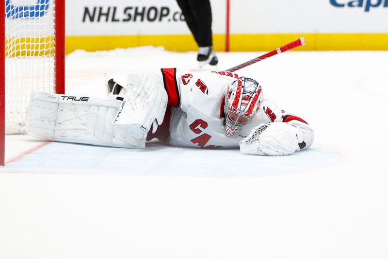 Mar 22, 2024; Washington, District of Columbia, USA; Carolina Hurricanes goaltender Pyotr Kochetkov (52) lays on the ice after making a save against Washington Capitals left wing Alex Ovechkin (not pictured) during a shootout against at Capital One Arena. Mandatory Credit: Amber Searls-USA TODAY Sports