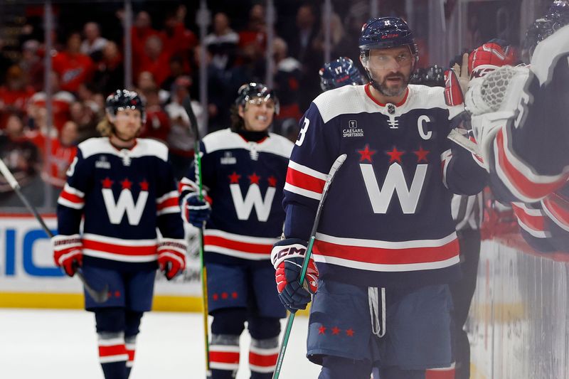 Feb 20, 2024; Washington, District of Columbia, USA; Washington Capitals left wing Alex Ovechkin (8) celebrates with teammates after scoring a goal against the New Jersey Devils in the third period at Capital One Arena. Mandatory Credit: Geoff Burke-USA TODAY Sports