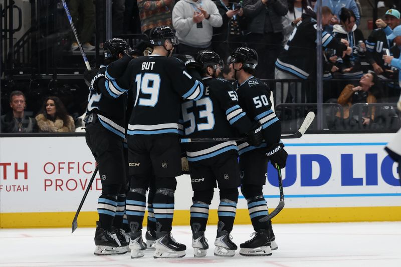 Dec 10, 2025; Salt Lake City, Utah, USA; The Utah Mammoth celebrate a goal by center Jack McBain (22) during the second period at Delta Center. Mandatory Credit: Rob Gray-Imagn Images