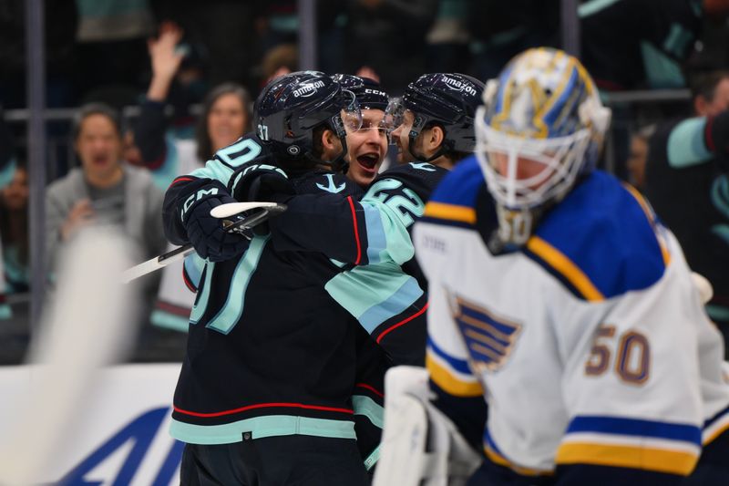 Jan 26, 2024; Seattle, Washington, USA; The Seattle Kraken celebrate after a goal scored against St. Louis Blues by Seattle Kraken right wing Eeli Tolvanen (20) during the second period at Climate Pledge Arena. Mandatory Credit: Steven Bisig-USA TODAY Sports