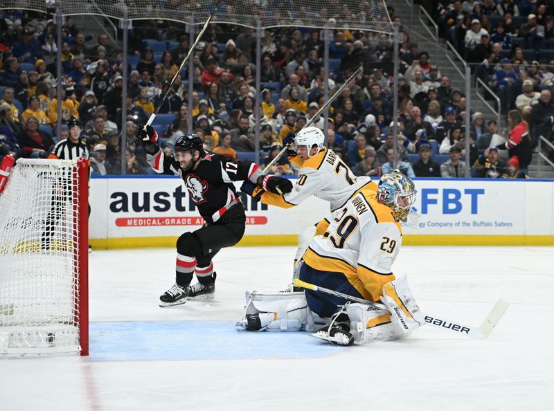 Jan 31, 2025; Buffalo, New York, USA; Buffalo Sabres left wing Jason Zucker (17) scores a goal against Nashville Predators goaltender Justus Annunen (29) and defenseman Justin Barron (20) in the second period at the KeyBank Center. Mandatory Credit: Mark Konezny-Imagn Images