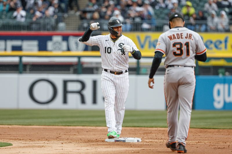 Apr 3, 2023; Chicago, Illinois, USA; Chicago White Sox third baseman Yoan Moncada (10) celebrates after hitting a double against the San Francisco Giants during the second inning at Guaranteed Rate Field. Mandatory Credit: Kamil Krzaczynski-USA TODAY Sports