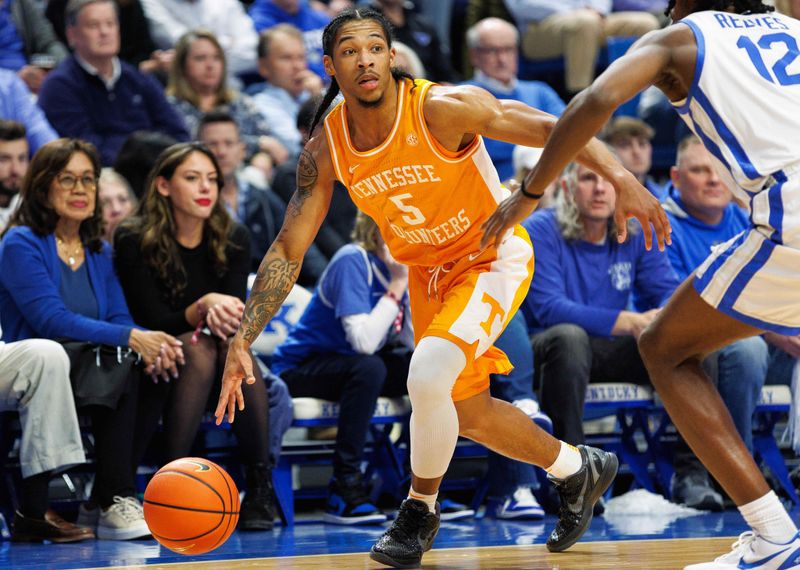 Feb 3, 2024; Lexington, Kentucky, USA; Tennessee Volunteers guard Zakai Zeigler (5) dribbles the ball during the first half against the Kentucky Wildcats at Rupp Arena at Central Bank Center. Mandatory Credit: Jordan Prather-USA TODAY Sports