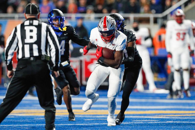 Nov 11, 2023; Boise, Idaho, USA;  New Mexico Lobos wide receiver Caleb Medford (4) runs for gain during the first half against the Boise State Broncos Albertsons Stadium. Mandatory Credit: Brian Losness-USA TODAY Sports

