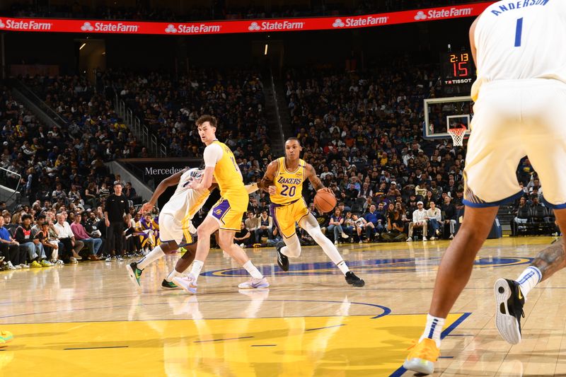 SAN FRANCISCO, CA - OCTOBER 18: Maxwell Lewis #20 of the Los Angeles Lakers drives to the basket during the game against the Golden State Warriors during a NBA Preseason game on October 18, 2024 at Chase Center in San Francisco, California. NOTE TO USER: User expressly acknowledges and agrees that, by downloading and or using this photograph, user is consenting to the terms and conditions of Getty Images License Agreement. Mandatory Copyright Notice: Copyright 2024 NBAE (Photo by Noah Graham/NBAE via Getty Images)