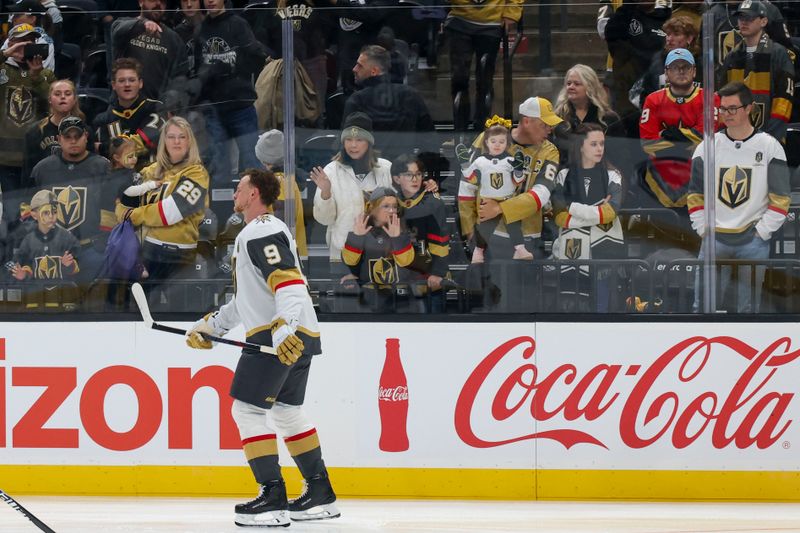 Nov 24, 2025; Salt Lake City, Utah, USA; Vegas Golden Knights fans watch center Jack Eichel (9) warms up before the game against the Utah Mammoth at Delta Center. Mandatory Credit: Rob Gray-Imagn Images