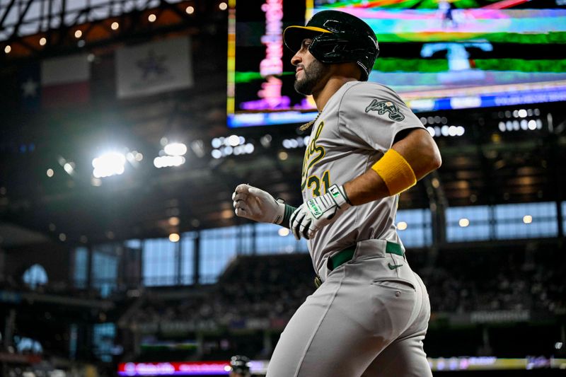 Apr 10, 2024; Arlington, Texas, USA; Oakland Athletics designated hitter Abraham Toro (31) comes off the field after scoring against the Texas Rangers during the first inning at Globe Life Field. Mandatory Credit: Jerome Miron-USA TODAY Sports