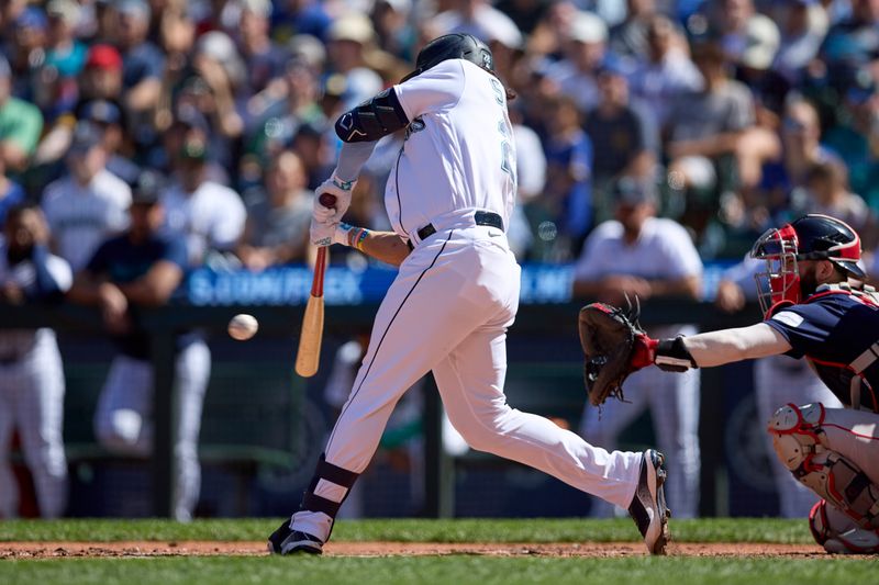 Aug 2, 2023; Seattle, Washington, USA; Seattle Mariners  Eugenio Suarez hits a single RBI against the Boston Red Sox during the seventh inning at T-Mobile Park. Mandatory Credit: John Froschauer-USA TODAY Sports