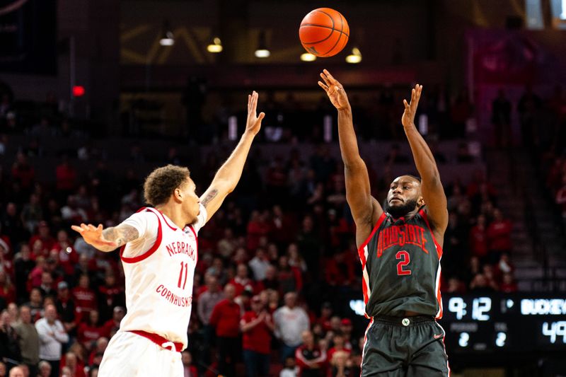 Jan 23, 2024; Lincoln, Nebraska, USA; Ohio State Buckeyes guard Bruce Thornton (2) shoots the ball against Nebraska Cornhuskers guard Eli Rice (11) during the second half at Pinnacle Bank Arena. Mandatory Credit: Dylan Widger-USA TODAY Sports