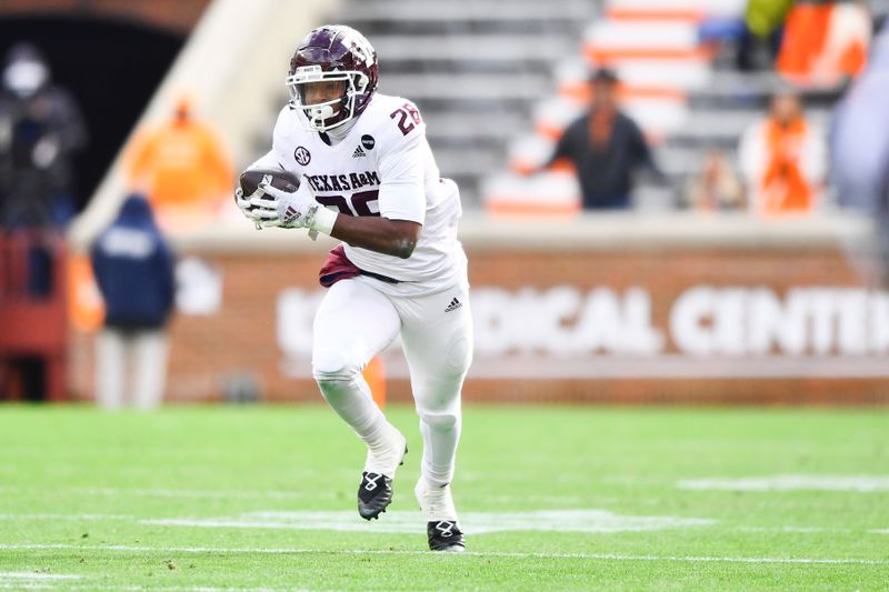 Dec 19, 2020; Knoxville, TN, USA;  Texas A&M running back Isaiah Spiller (28) runs the ball down the field during a game between Tennessee and Texas A&M in Neyland Stadium in Knoxville, Saturday, Dec. 19, 2020. Mandatory Credit: Brianna Paciorka-USA TODAY NETWORK