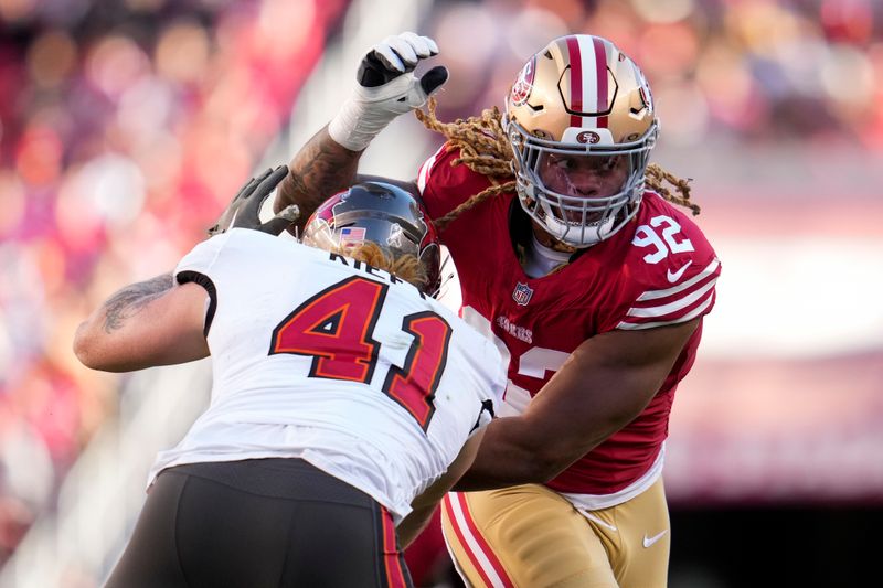 San Francisco 49ers defensive end Chase Young, right, gets past Tampa Bay Buccaneers tight end Ko Kieft during the second half of an NFL football game Sunday, Nov. 19, 2023, in Santa Clara, Calif. (AP Photo/Godofredo A. Vásquez)